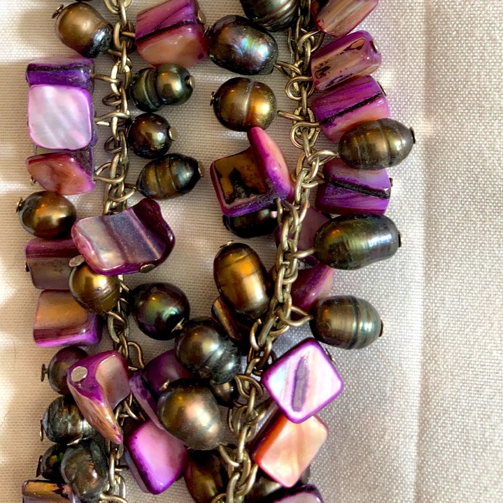 Really cool purple choker Beaded stone necklace with unique closure.